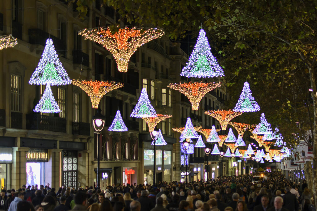 Barcelona, Catalonia, Spain - November 28, 2015: Avenida Portal del Angel in Barcelona. During a Saturday afternoon in late November, hundreds of people walk through one of the most commercial streets of Barcelona, making their Christmas shopping.