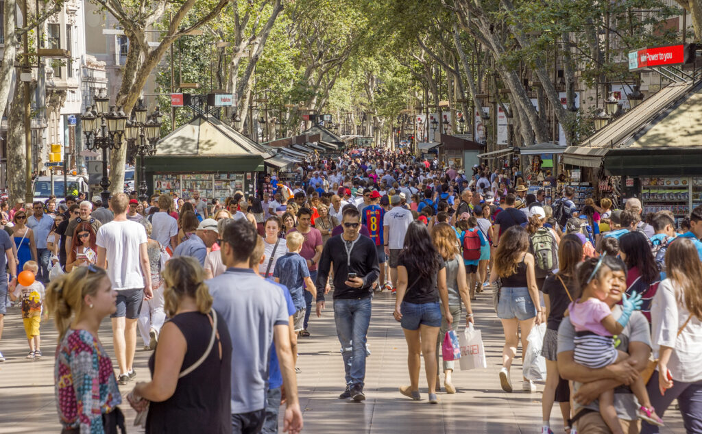 Barcelona, Spain Hundreds of people promenading in the busiest street of Barcelona, the Ramblas.