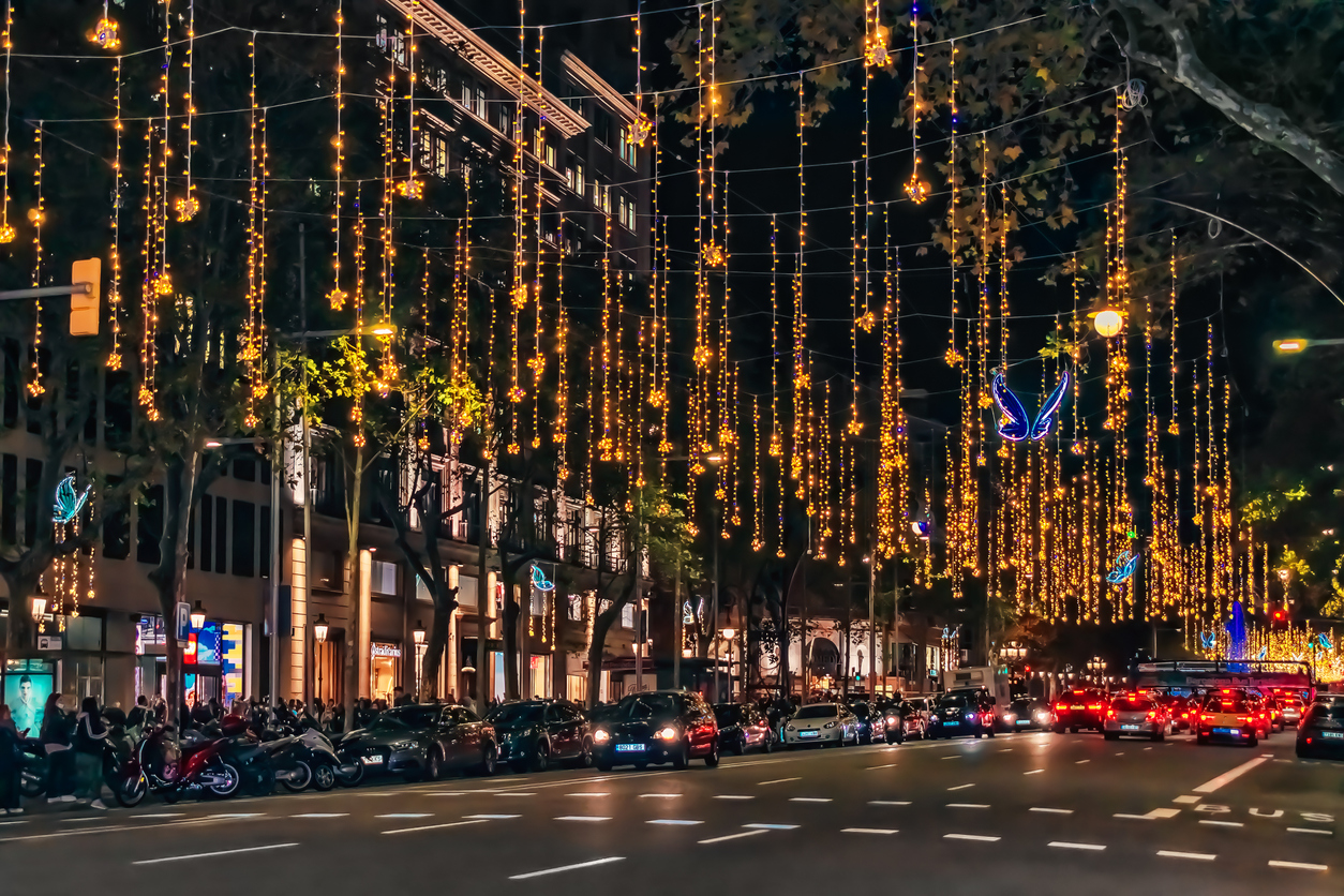 Christmas in Barcelona. Festive gold garlands with blue butterflies