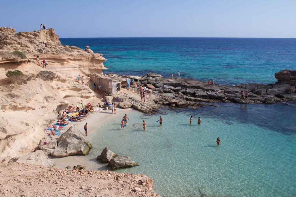 Group of People on Beach Shore in the Balearic Islands