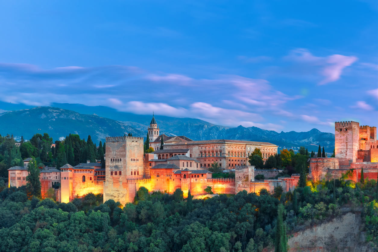 Alhambra during evening blue hour in Granada, Andalusia, Spain. Evening light falling on the Alhambra in Granada Spain.