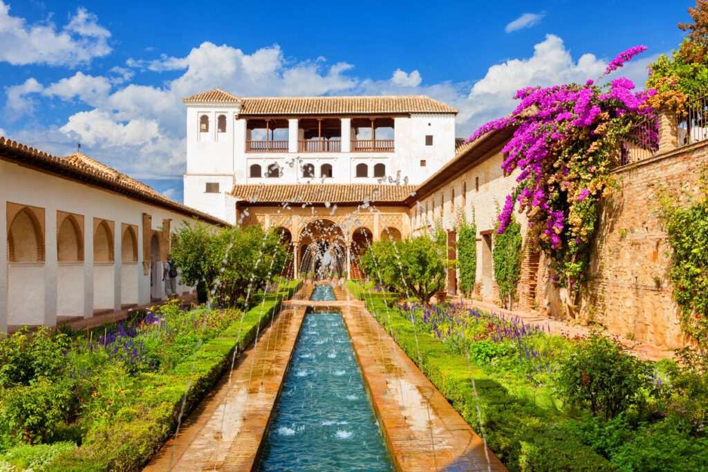 Granada, Spain - General view of the Generalife with its famous fountain and garden. Alhambra de Granada. UNESCO World Heritage Site