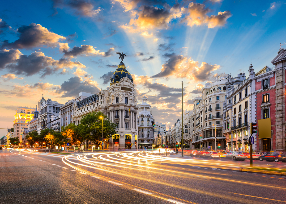 Madrid Spain on Gran Via. 24 hours in Madrid: wandering cobbled alleys, tapas time, city light magic at sunrise