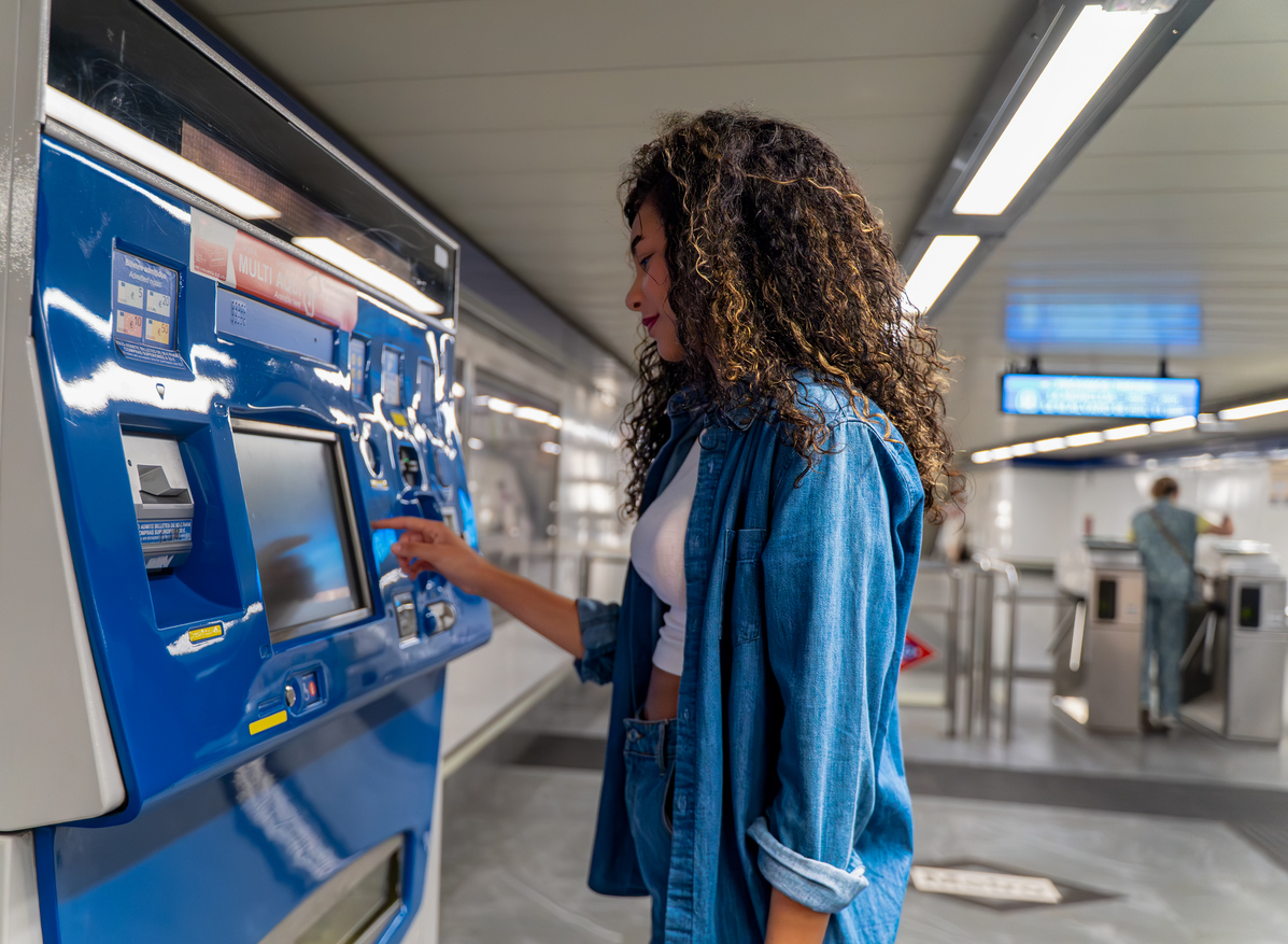 Traveler buying a ticket for public transportation in Spain